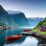 Home 23 노르웨이 국민 정체성 - A serene Norwegian fjord landscape at dawn, with traditional wooden fishing boats docked near rustic...